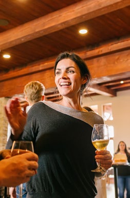 woman with a glass of white wine